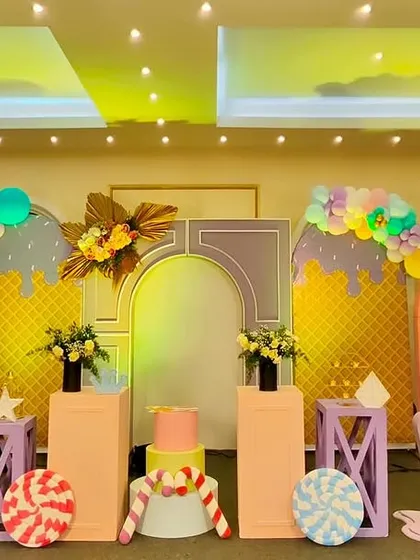 Let us build a sweet escape with a Candyland and ice cream theme. This vibrant stage is filled with pastel-colored balloon arrangements, giant ice cream cone props, candy-themed cutouts, and soft lighting to create a delicious-looking party atmosphere.