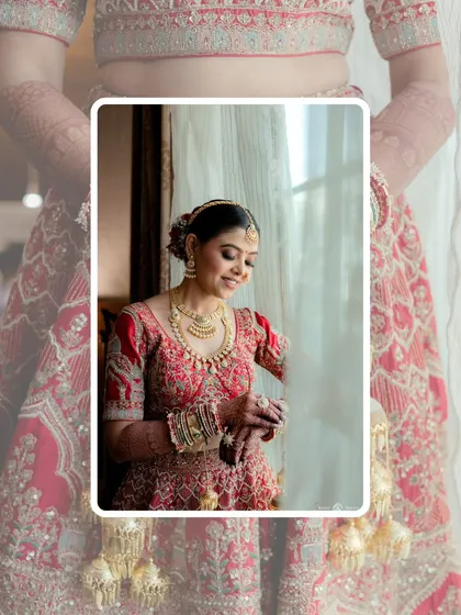 A creative portrait of the bride, framed by her own lehenga. This artistic shot highlights the beauty of both the bride and her stunning outfit.