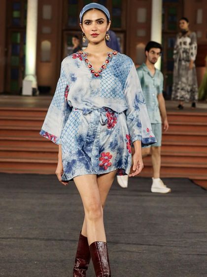 A collection from the 'Walking Hand in Hand' fashion show, where artisans share the spotlight with designers. This look, created with Liz Hartman, showcases pattern dye and discharge prints on handloom fabrics.