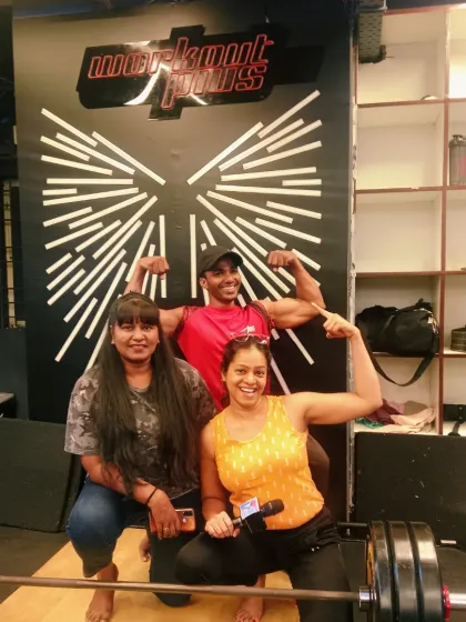 Posing with some of the strong participants at the gym event. My role is to be a hype-person, encouraging everyone and making the fitness challenge a fun and rewarding experience.