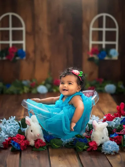 A huge, happy smile lights up the room! This is the joy we love to capture in our colorful and fun themed photoshoots.