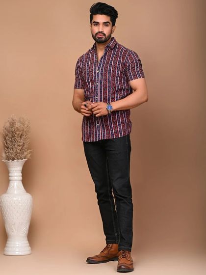 A side profile of the men's striped cotton shirt, showcasing its fit and pattern.