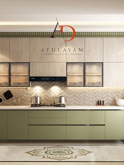 A full view of the U-shaped green and wood kitchen, showcasing the handleless cabinetry, herringbone backsplash, and integrated appliances for a clean, minimalist look.
