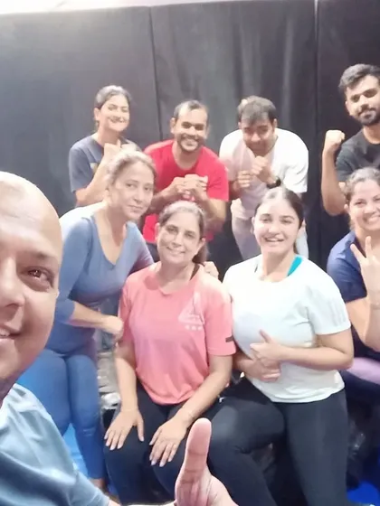 A happy group selfie with the coach. We build strong relationships and support each other's fitness journeys.
