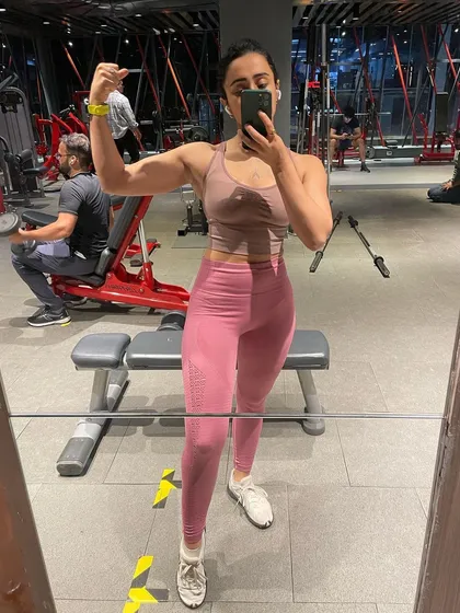 Capturing the results of consistent effort in the gym mirror. Each session is a step towards your personal fitness goals.