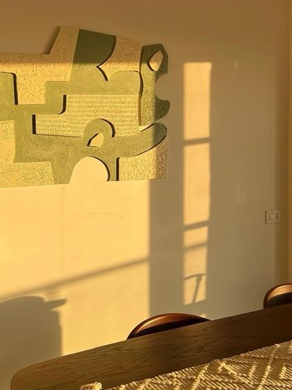 This 5ft wide sculptural piece is catching the golden hour sun in a Bangalore dining room. The light highlights the textures and adds a warm glow to the entire space.