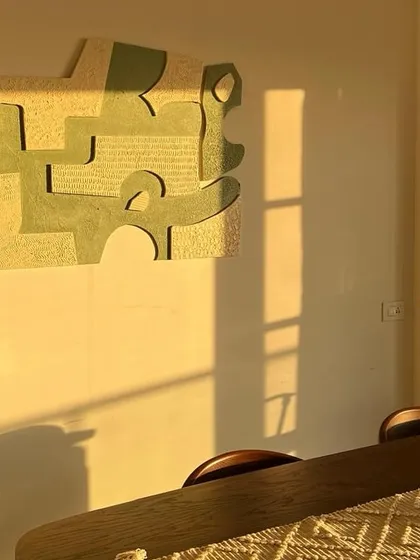 This 5ft x 2.5ft textured artwork looks stunning in the golden hour light at a client's home in Bangalore. The raised patterns create beautiful shadows that change throughout the day.