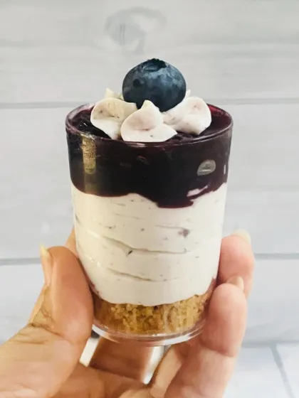 My Blueberry Cheesecake Shots are a party favorite. They have a crunchy biscuit base, a creamy cheesecake layer, and a sweet blueberry topping, all in a bite-sized shot glass.