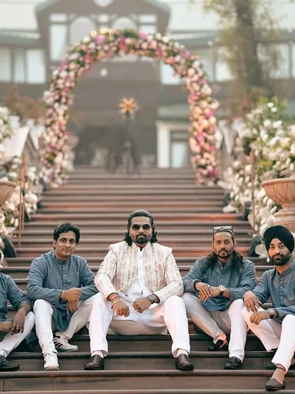 I also do custom outfits for the entire groom squad. Here, the groom stands out in his designer sherwani while his friends wear coordinated kurta sets, creating a picture-perfect moment.