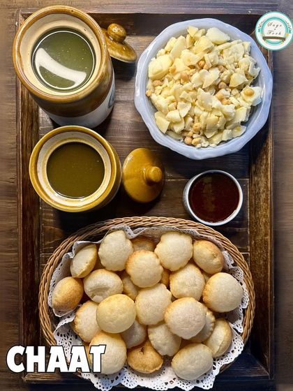 A classic Chaat platter featuring our DIY Gol Gappe set. This is a highlight of our house party menu, allowing guests to enjoy the authentic street food experience.
