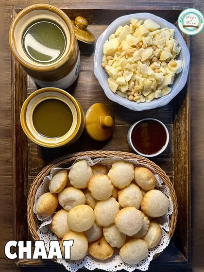 A clean, top-down shot of my Gol Gappa platter, showcasing the fresh ingredients and hygienic preparation that goes into every order.
