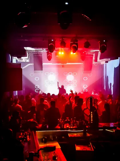 The view from my console at a packed club night. Seeing a sea of people vibing to the music is what it's all about. I live for creating these high-energy moments.