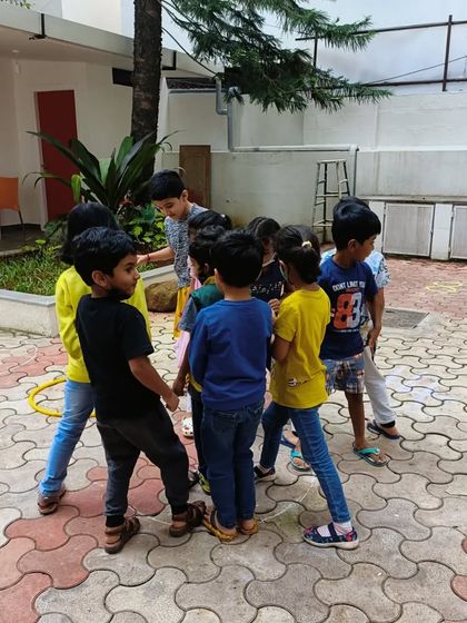 Teamwork makes the dream work! Kids collaborating during a math game in our outdoor area.