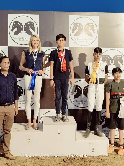 Yug Shokeen and his horse Agni on top of the podium after winning the Gold medal in 80 cm open jumping at the Verdinand Horse Show.