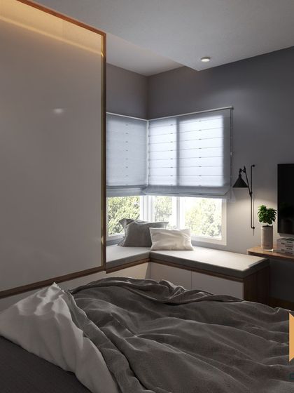 This minimalist bedroom includes a cozy L-shaped window seat with built-in storage, making the most of a small corner.