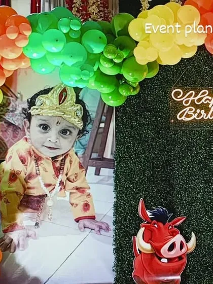 A close-up of the birthday boy enjoying his jungle-themed party.