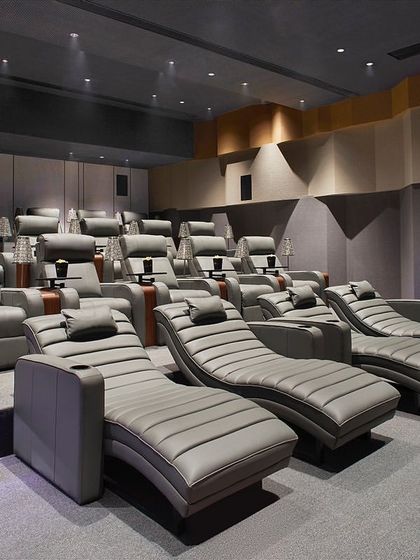 The tiered seating in the Rustomjee Elements theater ensures an unobstructed view for every guest. The room is fully treated with acoustic paneling on the walls and ceiling to create a professional-grade sound environment.