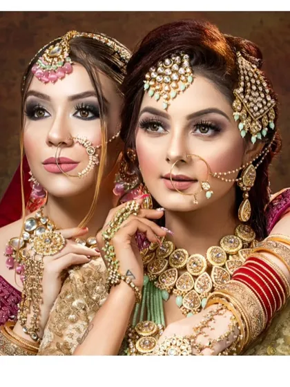 Two models showcasing different bridal looks, one in gold and one in green. This highlights the variety available in my collection for the bride and her sister or friend.