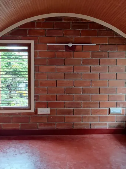 A room with an arched, vaulted ceiling made of exposed brick, demonstrating a classic and durable construction technique.
