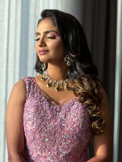 A serene portrait with eyes closed, showing the beautiful blend of colors on her eyelids.