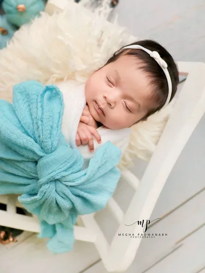 A close-up on the baby's peaceful, sleeping face.