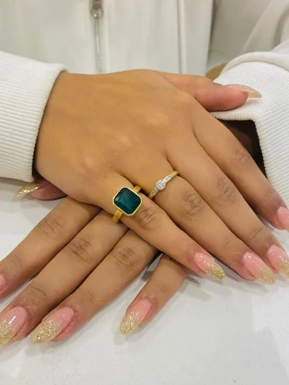 Gold glitter adds a touch of warmth and luxury. These long, elegant nail extensions feature a sparkling gold glitter fade at the tips, creating a glamorous and festive look perfect for celebrations.