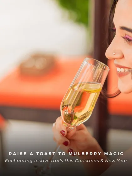 Raise a toast to Mulberry Magic. A guest enjoys a glass of bubbly during our festive Christmas and New Year celebrations, creating unforgettable memories.