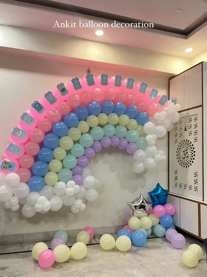 The completed pastel rainbow balloon backdrop, a unique and eye-catching decoration for any party.