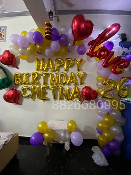 A complete view of the custom birthday balloon wall I designed. It serves as a perfect photo backdrop for the celebration.