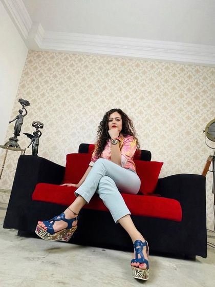 Posing on the set of a documentary shoot. My work often puts me in front of the camera, and I use these experiences to practice the same on-camera presence I teach my clients.