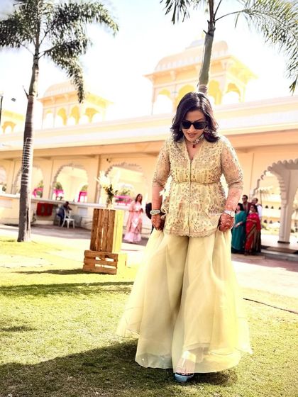 Another angle of the sister of the groom's beautiful welcome lunch outfit. The flowy sharara pants and embroidered peplum top offered a perfect blend of comfort and high fashion.