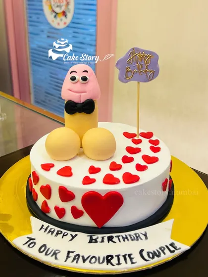 A fun adult-themed cake for a 'favourite couple's' birthday. This design is full of hearts and humor, making it a playful and memorable centerpiece.