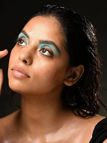 This upward-looking pose emphasizes the graphic shape of the eyeshadow. I teach students how to direct models to get the most impactful shots for their portfolio.