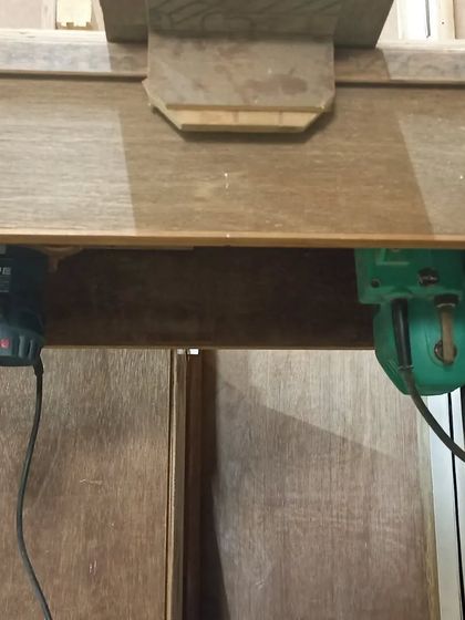 A view from underneath the router table, showing the two routers mounted. This setup gives me a lot of versatility without taking up too much space.