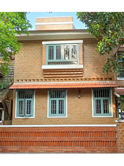 A duplicate of the home's facade with soil cement blocks.