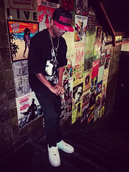 A candid shot, just vibing. My style is a mix of hip-hop culture and my own personality.