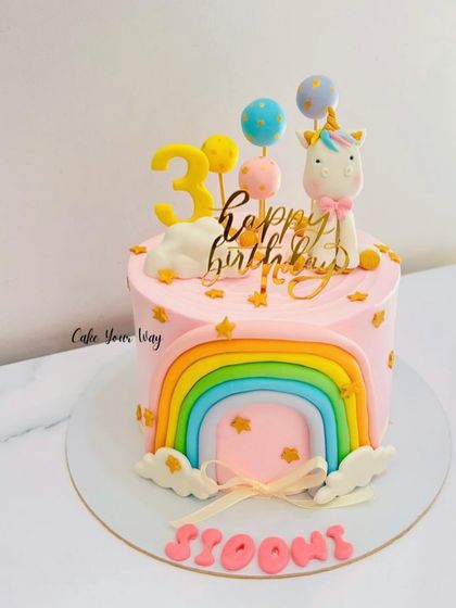 A whimsical unicorn and rainbow cake for a 3rd birthday. The pastel colors and fondant details make this a dreamy and popular choice.