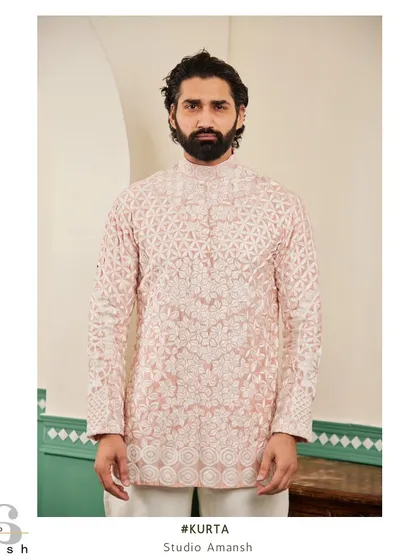 Our blush pink kurta, featuring a stunning geometric floral pattern in all-over white hand-embroidery.