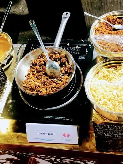 This is my interactive Dryfruit Goond Bhel station. Guests can watch as we mix edible gum, dry fruits, and fresh khoya, served with a choice of jaggery or pistachio sauce for a customized sweet treat.