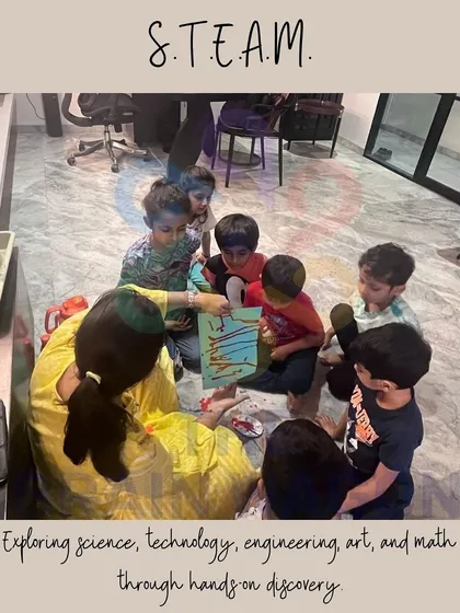 Exploring science, technology, engineering, art, and math through hands-on discovery. Here, children are working together on a STEAM project, learning through collaboration and experimentation.