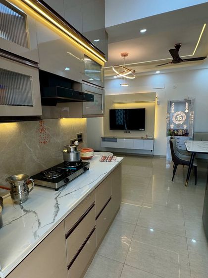 From this angle, you can see how the open kitchen layout connects with the living and dining area, creating a cohesive living space.