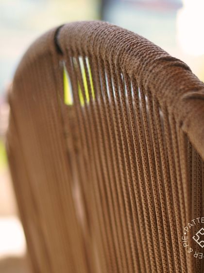 Patterns of Paper & Pie. A close-up on the intricate weaving of our chair backs, a detail that adds texture and warmth.