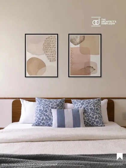 A simple and clean bedroom design from 'A Walk in the Clouds', with a wooden headboard ledge and a calm blue and white color scheme.