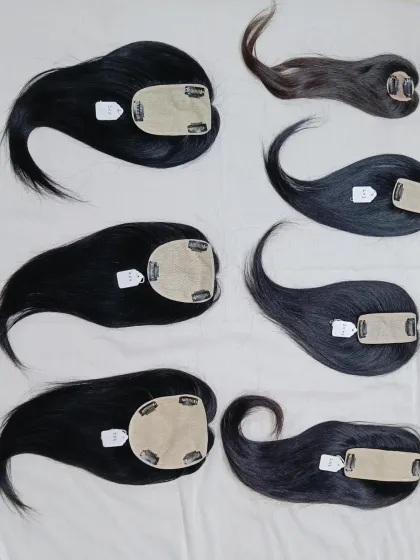 Another angle showcasing the variety in my hair topper inventory. Notice the different shapes and lengths, all made with high-quality human hair that you can style.
