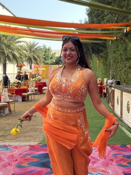 My favorite season is wedding season, especially for a vibrant Haldi ceremony. Here I am, all set in my orange outfit, ready to bring the sunshine and energy to the party.