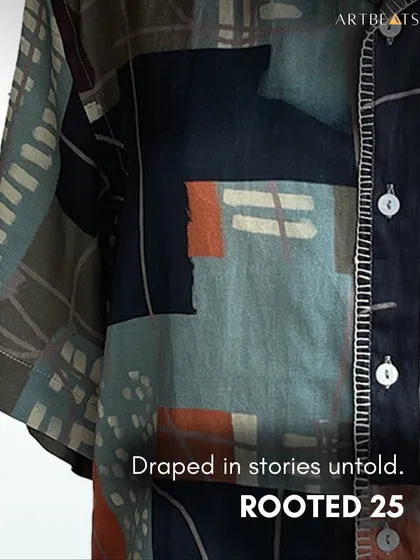 Draped in stories untold. This close-up of the Earthlines shirt emphasizes its connection to the Rooted '25 collection, a line of clothing for the stories we hold.
