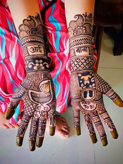 A clear top-down view of the baby shower design, showing the symmetry and detail in the finger patterns and wrist cuffs.