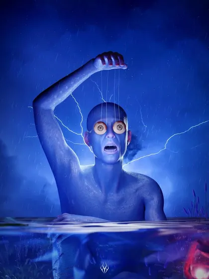 A version of the puppet 'Watcher' emerging from water. The split view above and below the waterline adds another layer to the composition, hinting at something hidden beneath the surface.