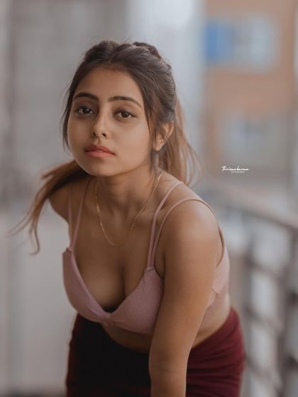 This portrait has a candid, in-the-moment feel. The pose and expression are natural and engaging.