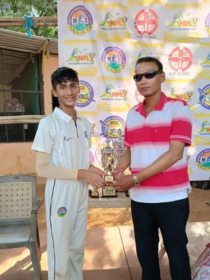 A player from our victorious U-17 MPL team being awarded his trophy.